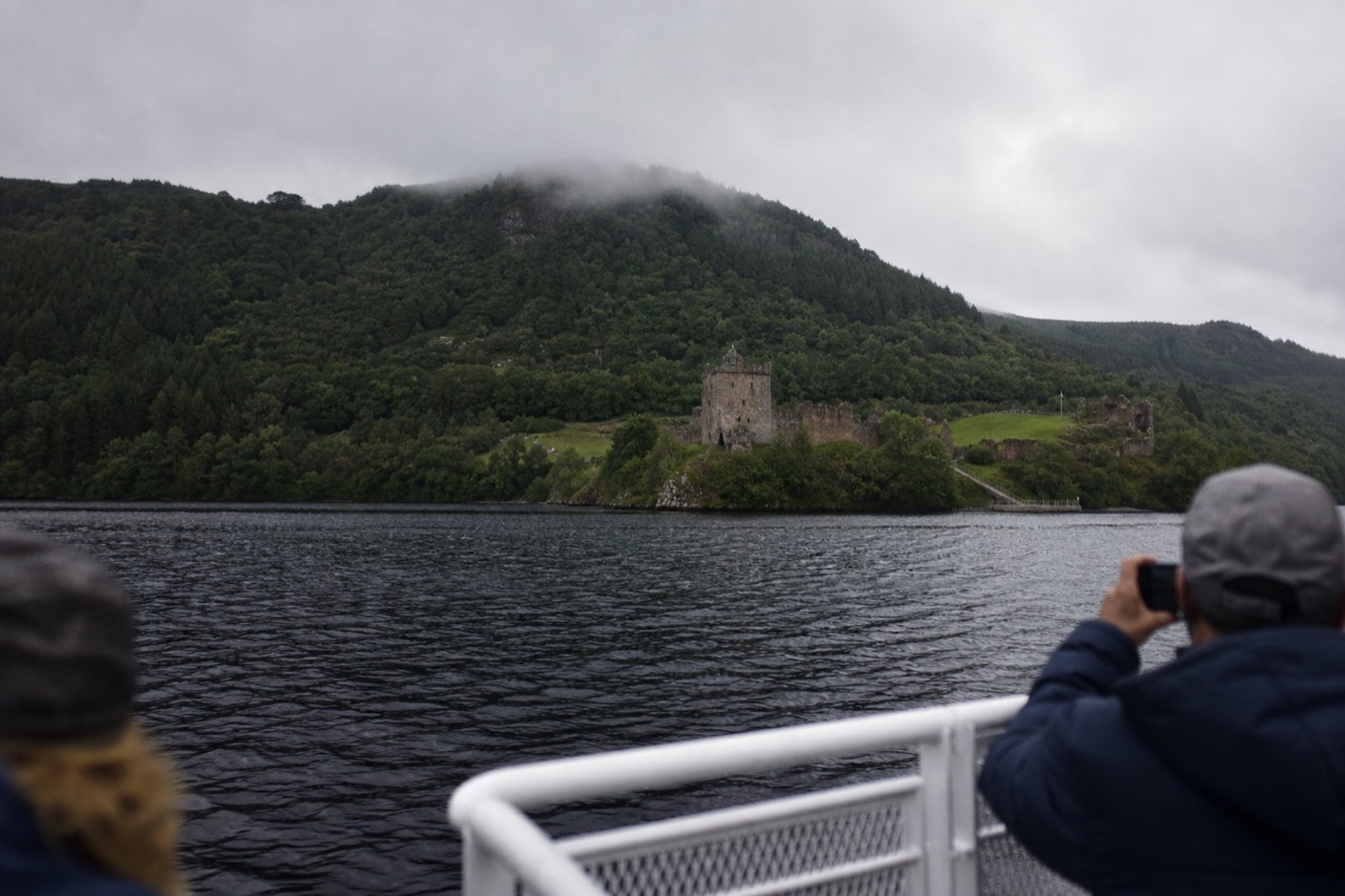 View from a Loch Ness cruise of Urquhart Castle above the dark water of the Great Glen
